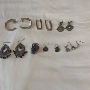 7 silvertone vintage earrings.